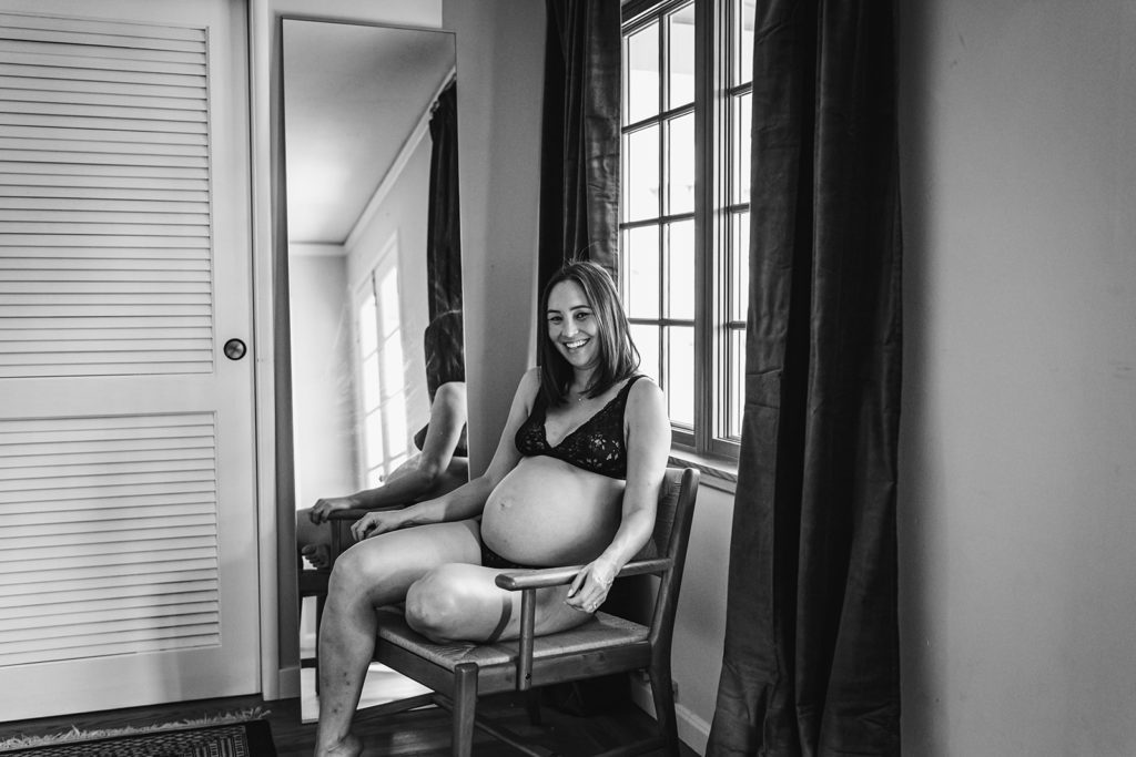 Celebrating a pregnant person's body during this intimate Pregnancy photo session showing off her round baby bump during a third trimester at home maternity session in San Francisco Bay Area by Xilo Photography, Inclusive Intimate Photographer