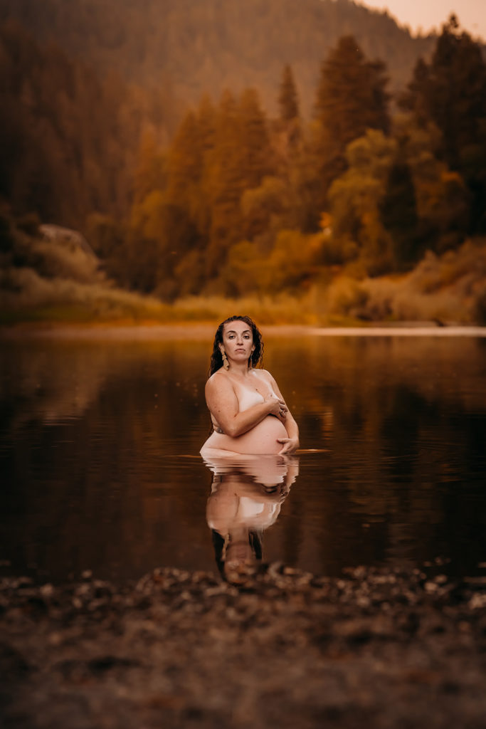 Celebrating the beauty of a parent's body through intimate maternity boudoir photoshoots outdoors in a lake and river at Russian River in San Francisco Bay Area. Captured by Xilo Photography's Kati Douglas of Oakland, California