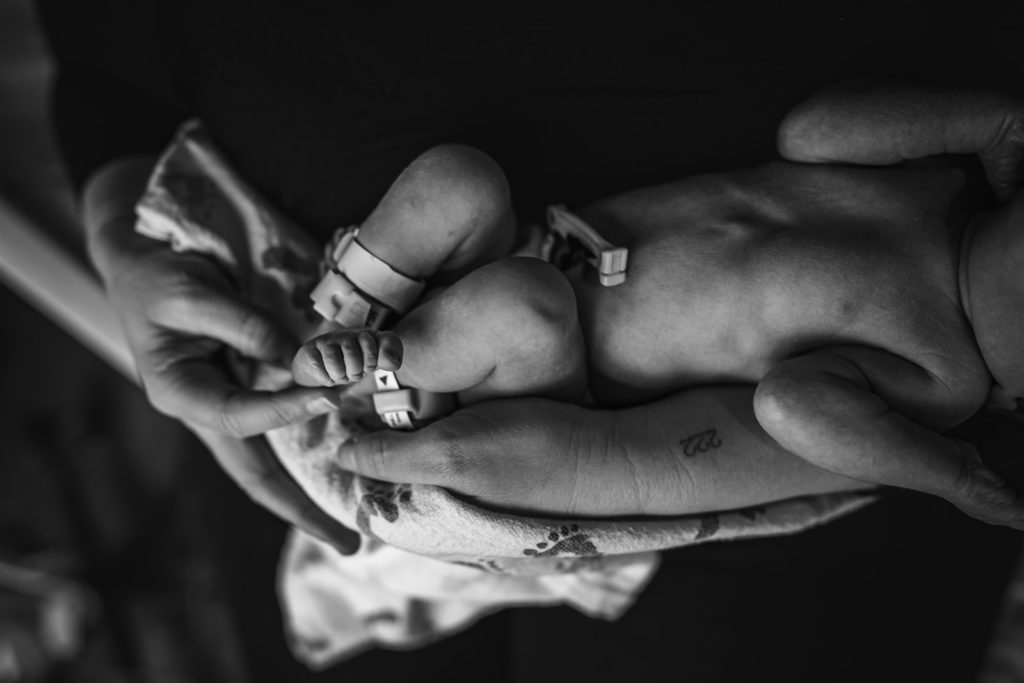 Alta Bates Hospital Newborn baby portrait in mother's arms and snuggling with skin on skin - macro photography