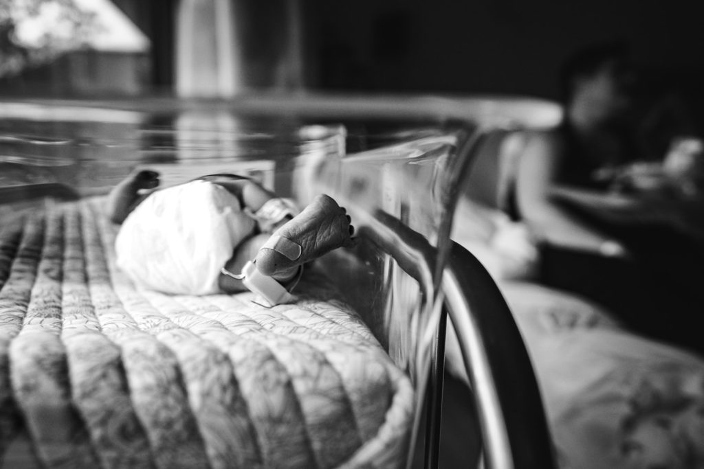 Fresh 48 Newborn Portrait In Hospital Basinet At Alta Bates, Berkeley, CA by Documentary Photographer, Kati Douglas With Xilo Photography